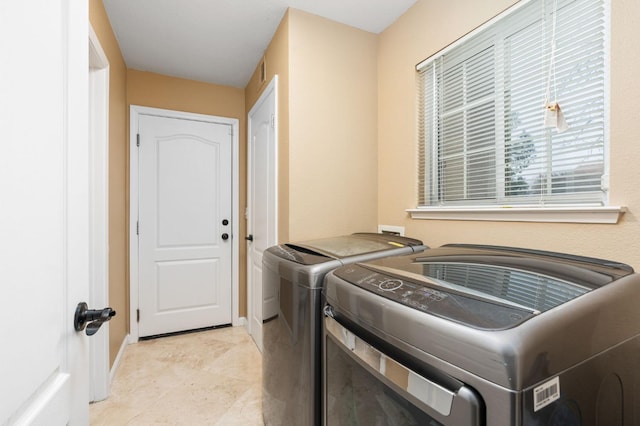 washroom featuring independent washer and dryer