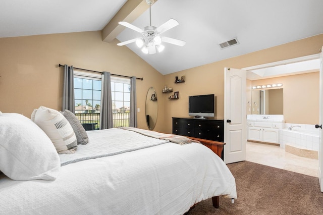 bedroom featuring ceiling fan, light colored carpet, connected bathroom, and lofted ceiling with beams