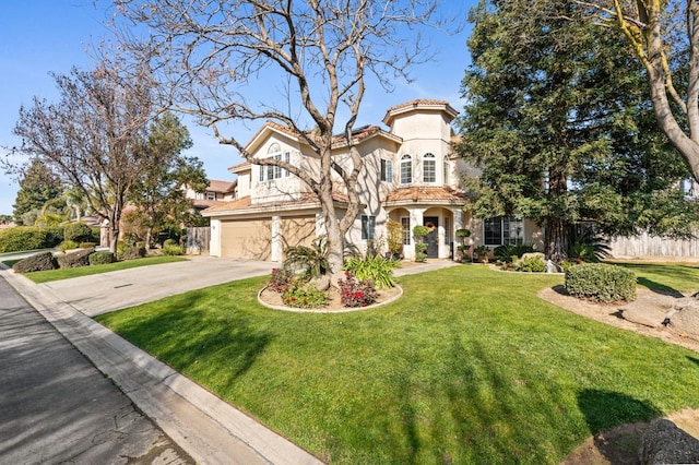 mediterranean / spanish house featuring a garage and a front lawn