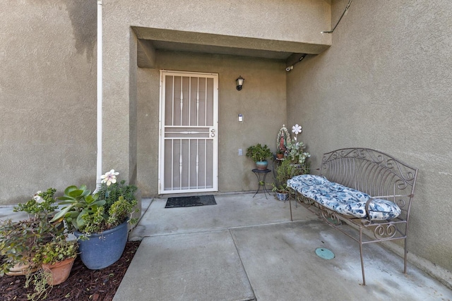 entrance to property with a patio