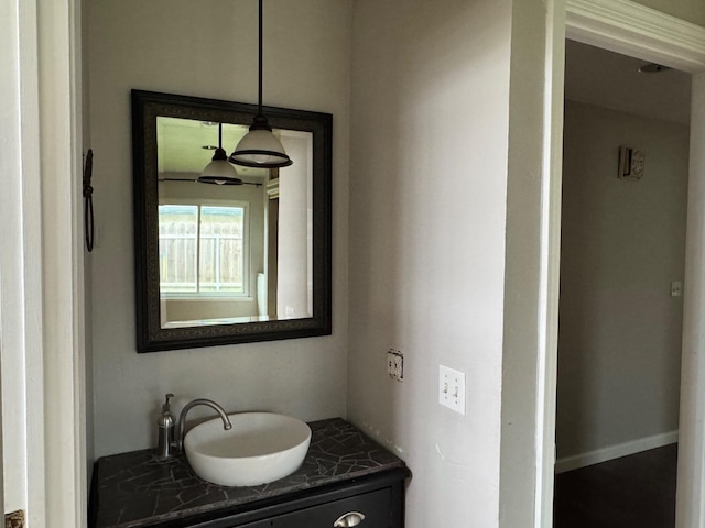 bathroom with baseboards and vanity