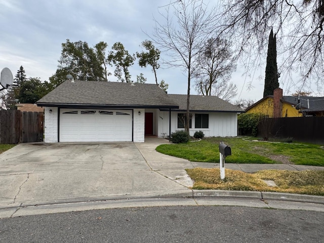 ranch-style house featuring brick siding, an attached garage, a front lawn, and fence