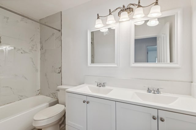 full bath with a sink, shower / bathing tub combination, toilet, and double vanity