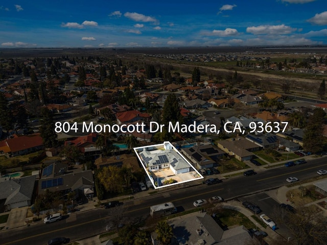 birds eye view of property with a residential view