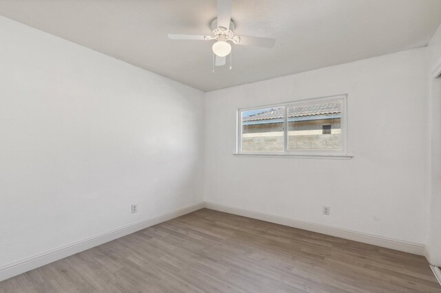 unfurnished room with light hardwood / wood-style floors and ceiling fan