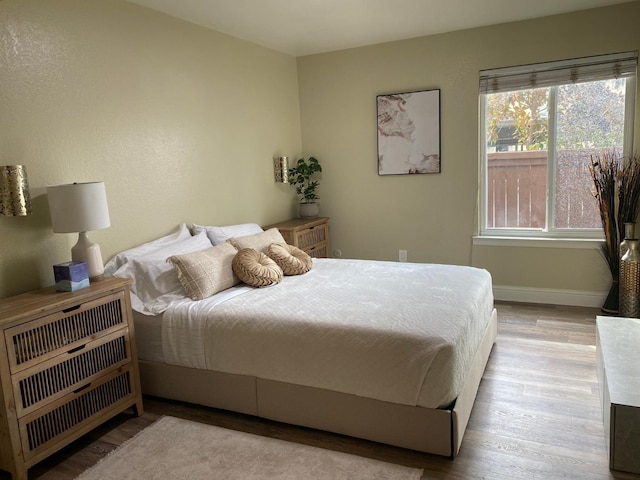 bedroom with light wood-type flooring