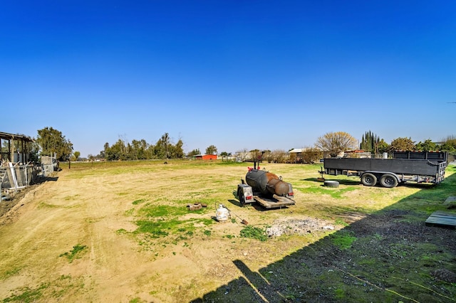 view of yard with a rural view