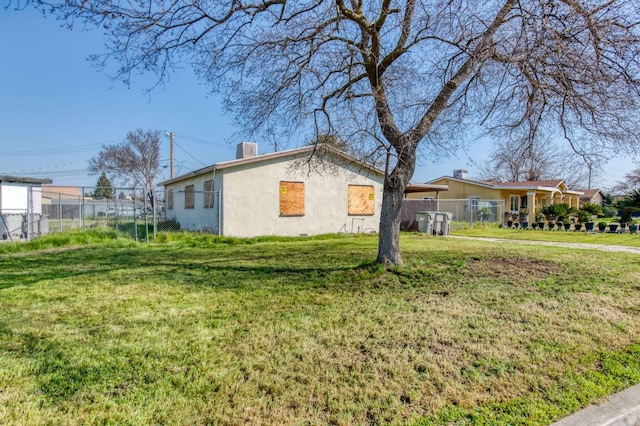 view of property exterior with a lawn