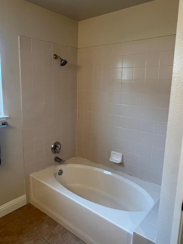 bathroom featuring tile patterned flooring and tiled shower / bath combo