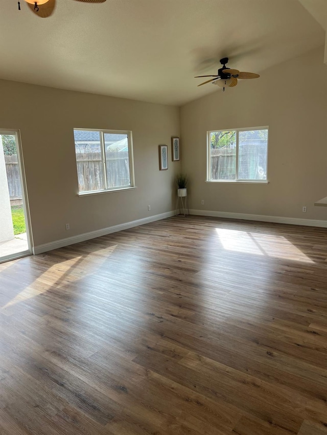 unfurnished room with lofted ceiling, wood-type flooring, and ceiling fan