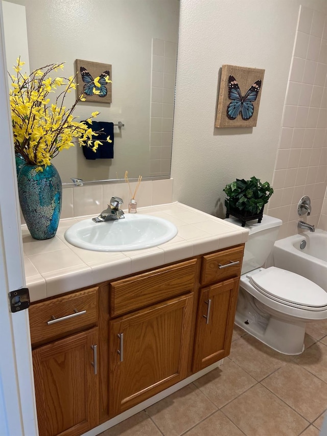 full bathroom with vanity, tile patterned floors, shower / bathtub combination, and toilet