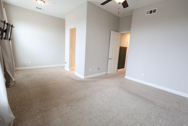 carpeted empty room with ceiling fan