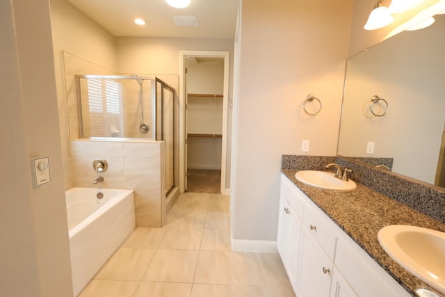 bathroom featuring vanity, separate shower and tub, and tile patterned floors