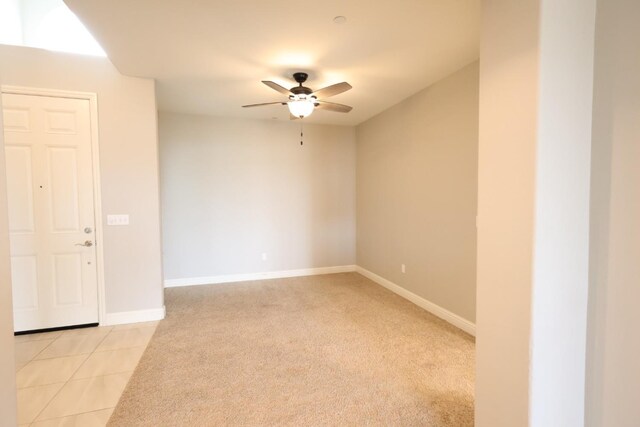 carpeted empty room with ceiling fan