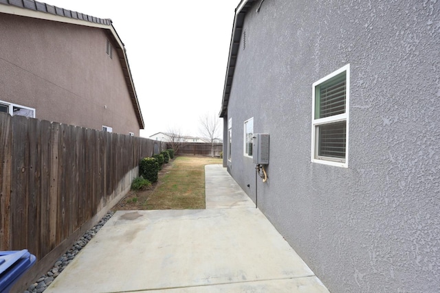 view of property exterior featuring a patio