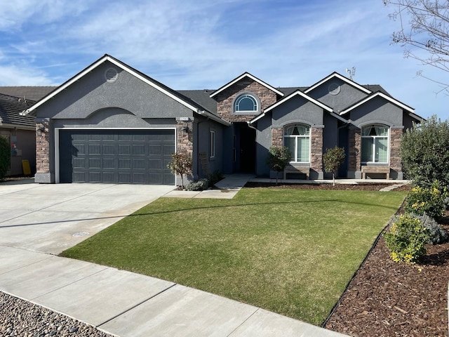 view of front of house with a garage and a front yard