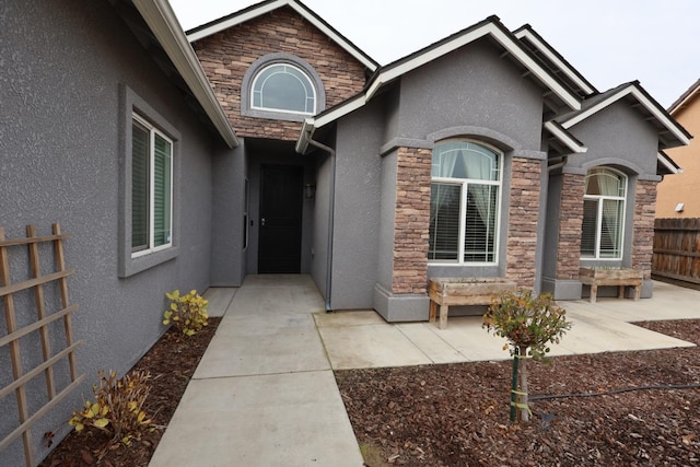 entrance to property with a patio area