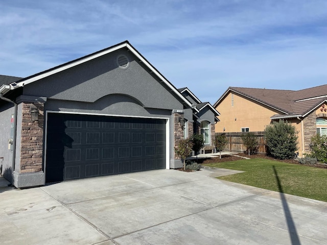 ranch-style home featuring a garage and a front lawn