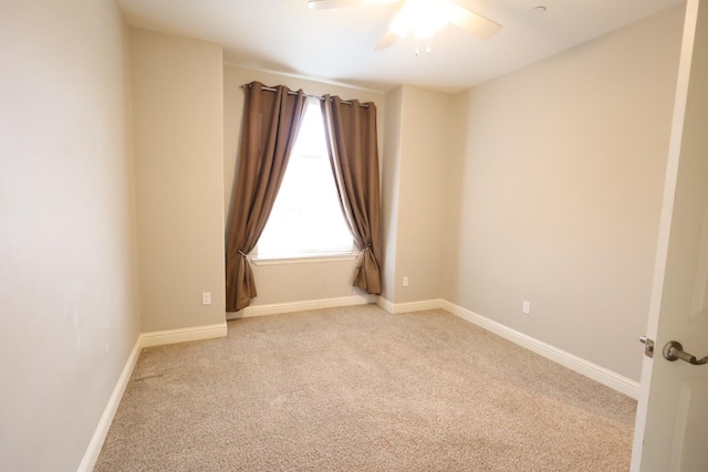 unfurnished room featuring ceiling fan and light colored carpet