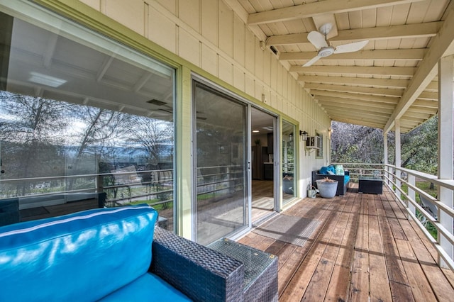 wooden terrace featuring ceiling fan