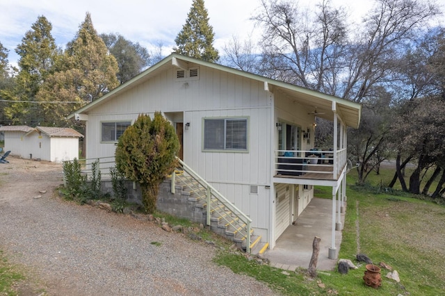 view of front facade with a garage and a shed