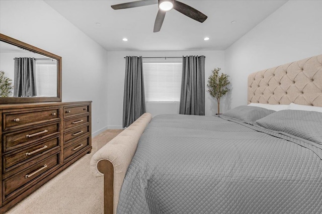 bedroom with light carpet and ceiling fan