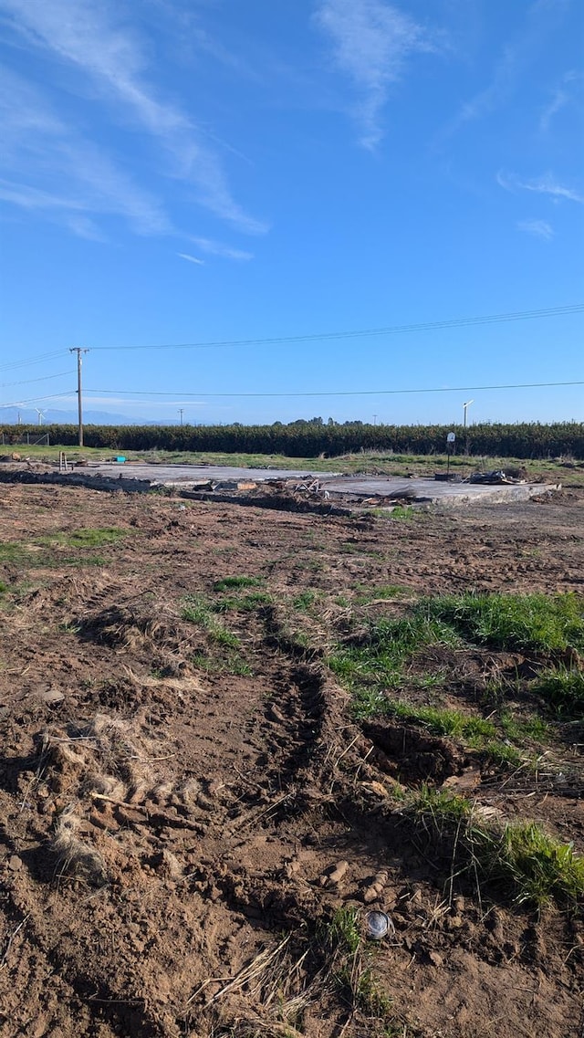 view of yard with a rural view