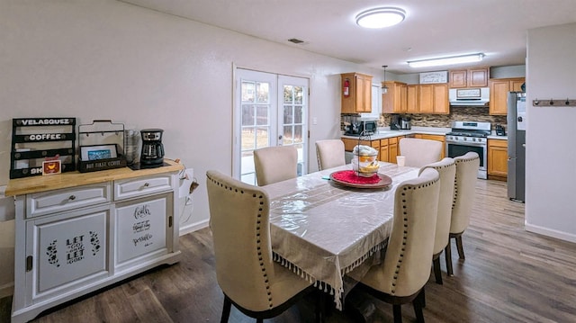 dining room with dark hardwood / wood-style floors