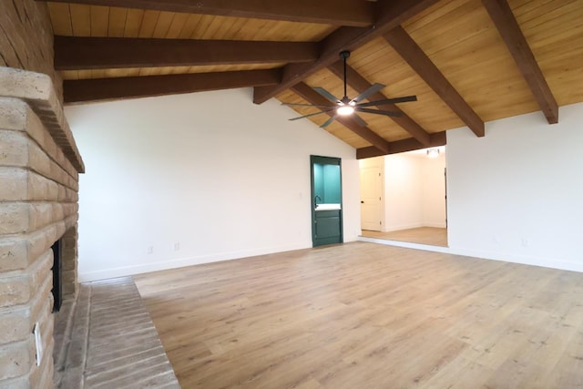 unfurnished living room with vaulted ceiling with beams, wood ceiling, wood-type flooring, a brick fireplace, and ceiling fan