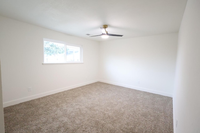 spare room with ceiling fan and carpet flooring