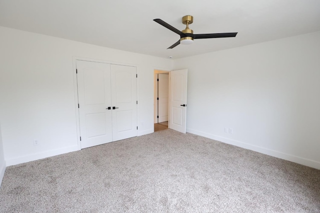 unfurnished bedroom featuring ceiling fan, carpet flooring, and a closet