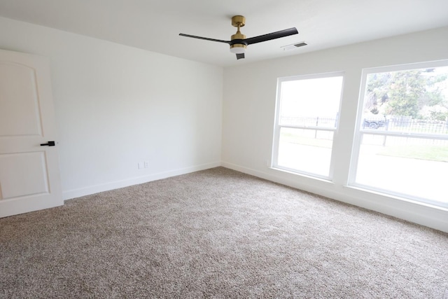 unfurnished room with carpet floors and ceiling fan