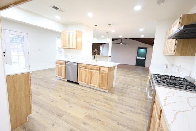 kitchen featuring pendant lighting, stainless steel appliances, light brown cabinetry, and light hardwood / wood-style flooring