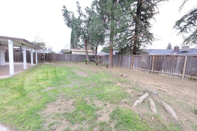 view of yard featuring ceiling fan and a patio area