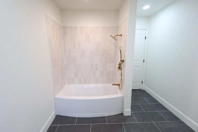 bathroom with tiled shower / bath and tile patterned floors