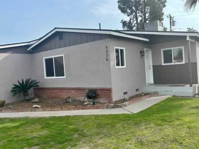 exterior space featuring crawl space and a lawn