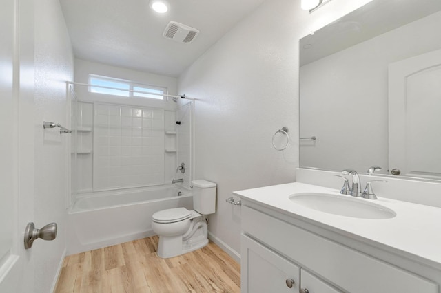 full bathroom with vanity, toilet, tub / shower combination, and hardwood / wood-style floors