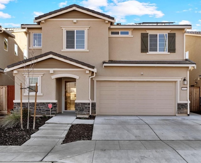 view of front of property with a garage