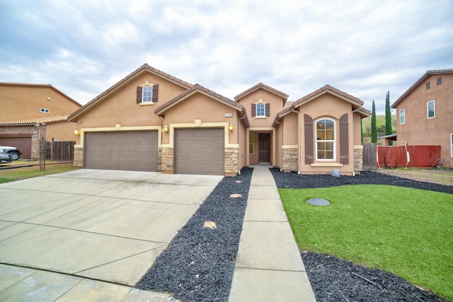 view of front facade with a garage and a front yard