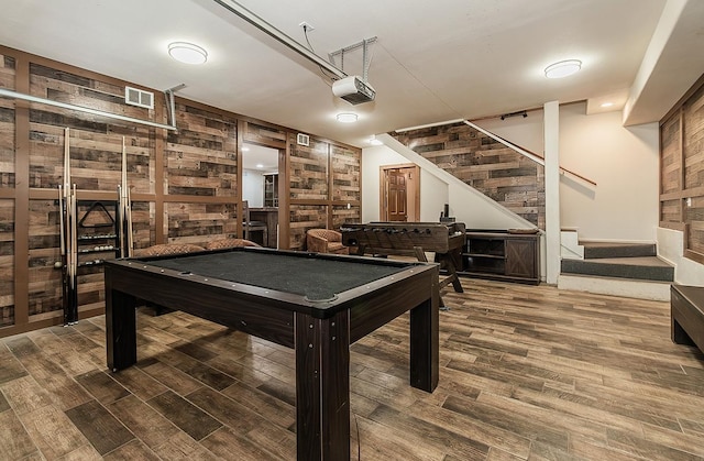 playroom featuring wood-type flooring, wooden walls, and billiards