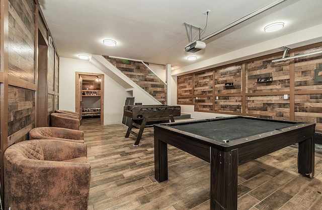 game room with hardwood / wood-style floors and billiards