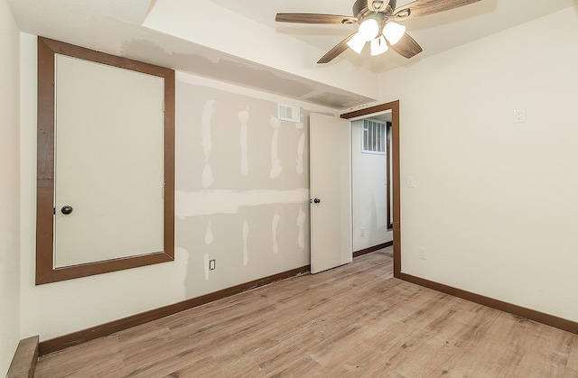 unfurnished room with ceiling fan and light wood-type flooring