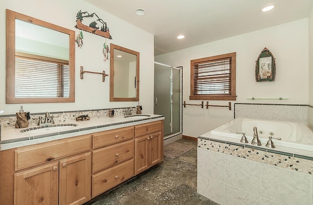 bathroom with independent shower and bath and vanity