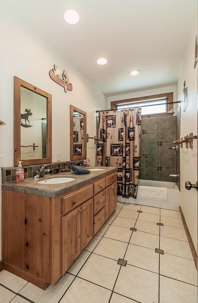 bathroom with vanity, tile patterned flooring, and shower / bath combo