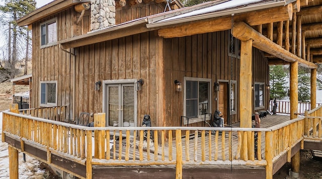 back of house featuring a deck