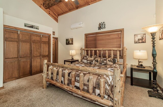 carpeted bedroom with a wall mounted AC, wooden ceiling, high vaulted ceiling, and a closet