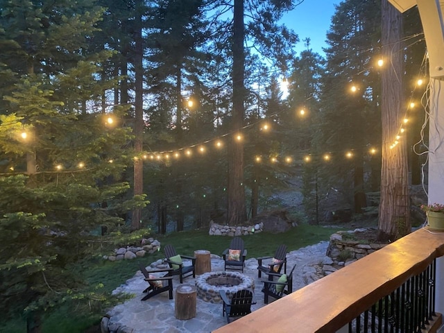 view of yard with a patio and a fire pit