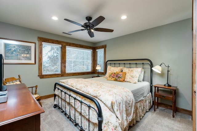 bedroom with light colored carpet and ceiling fan