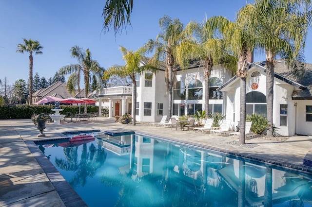 view of swimming pool featuring a patio area