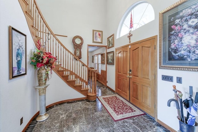 entrance foyer with a towering ceiling